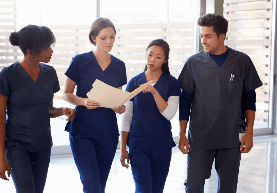 group of nurses reviewing chart