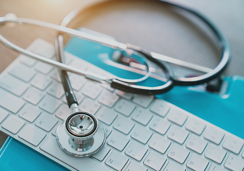 White keyboard with a stethoscope on top