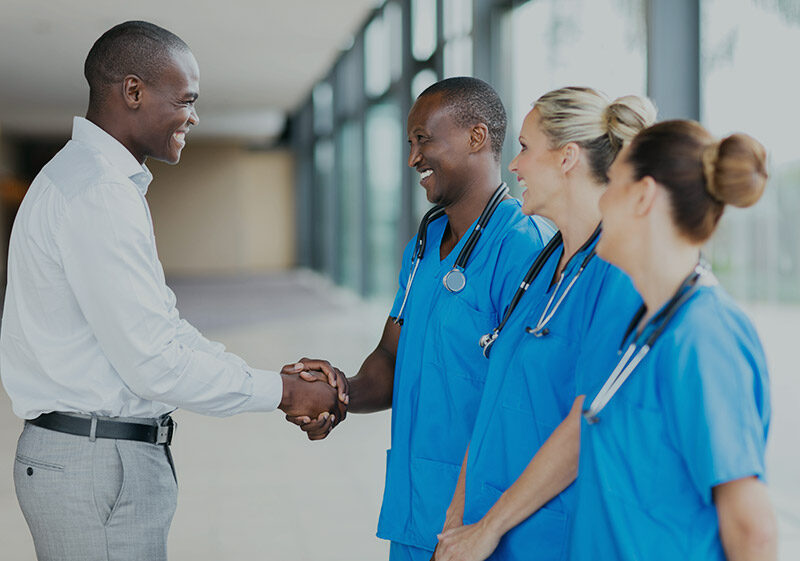 Man shaking doctor's hand